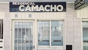 A hotel facade with a sign reading "RESIDENCIAL CAMACHO" and a smaller sign for "HOTEL CAMACHO". - HOTEL RESIDENCIAL CAMACHO (Cordoba)