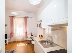 Fridge, microwave, stovetop, coffee/tea maker