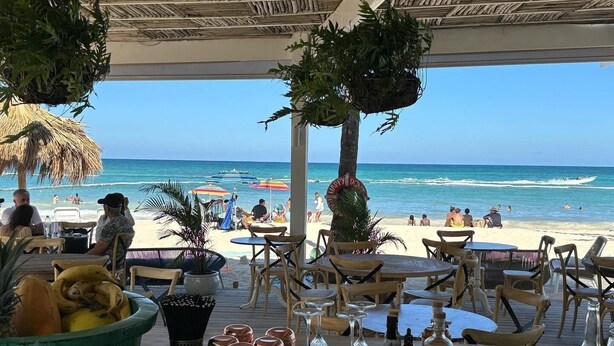 A beachside restaurant with outdoor seating, overlooking the ocean. - Playa Turquesa Ocean Club, A-203, cozy 1-BR apartment, AC, WiFi, private beach (Bavaro)