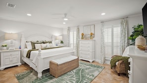 A bedroom with a bed, nightstands, a dresser, a bench, a ceiling fan, and a window with curtains. - Newly Renovated! 2-min Walk to the Beach The Coastal Cottage by Avantstay (Panama City Beach)