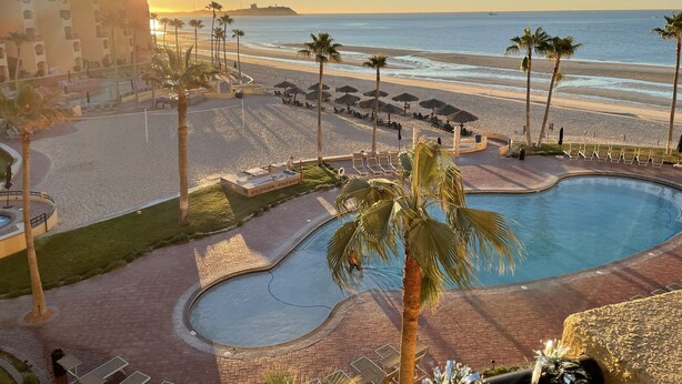A resort with a swimming pool, beach, and ocean view. - RockyCondo - Princesa A-407 Beach Front 2 Bed 2 Bath Condo (Puerto Penasco)