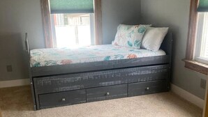 A bedroom with a bed, a window, and a door. - Walk to Beach & Festivities All Summer at the Jersey Shore! (Long Branch)