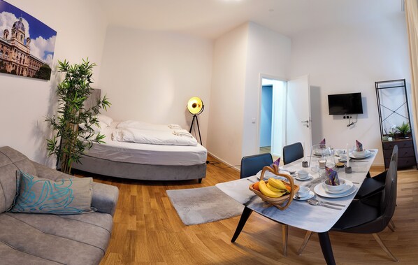 Design Apartment, 2 Bedrooms | Living area | 35-inch Smart TV with digital channels