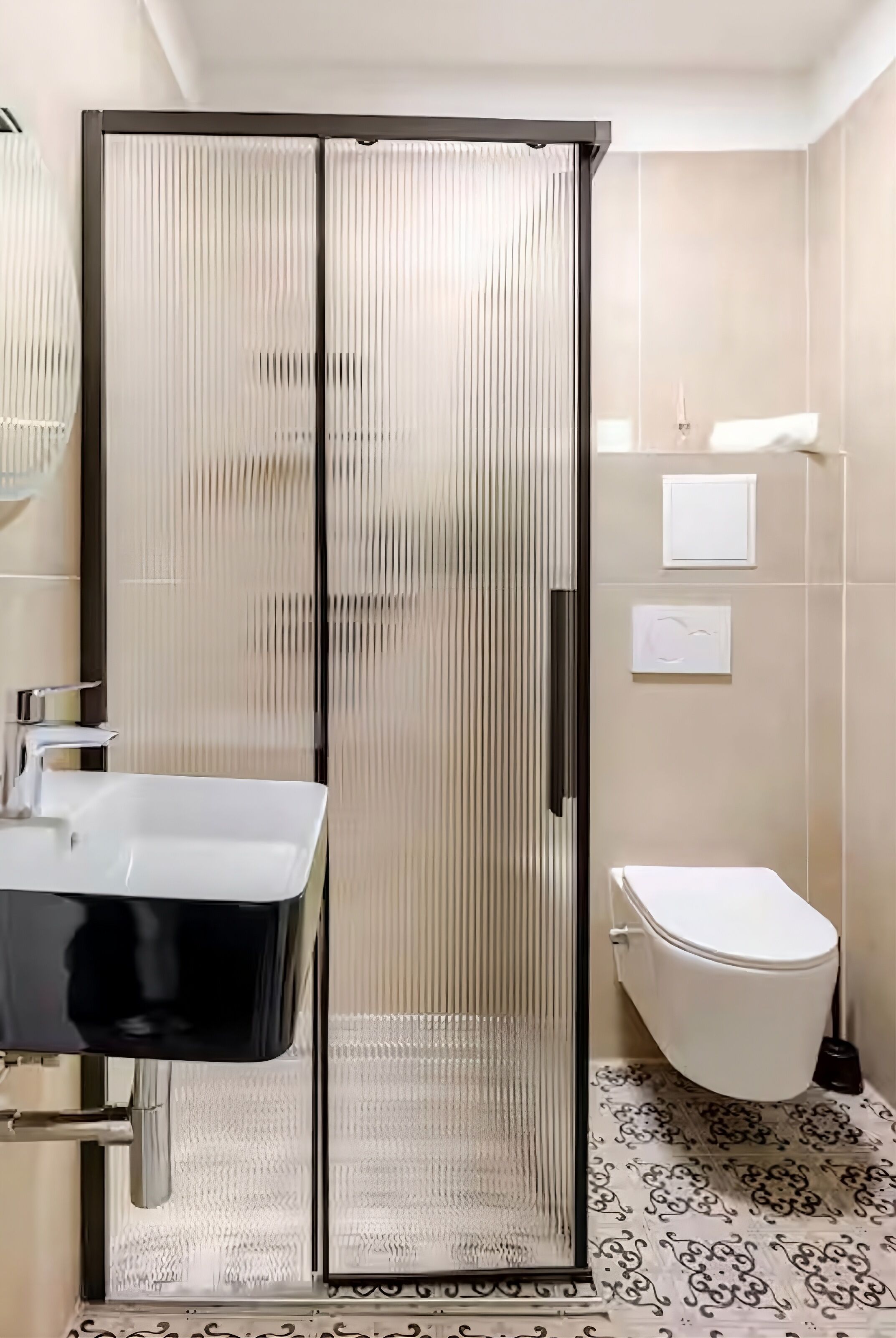 A bathroom with a glass-enclosed shower, a white sink, and a toilet.
