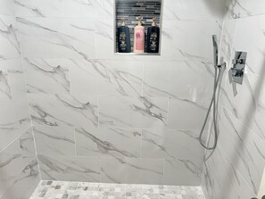 Shower, hair dryer, towels, soap