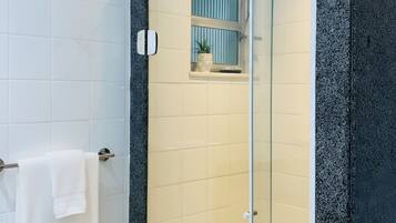 Shower, hair dryer, towels, toilet paper