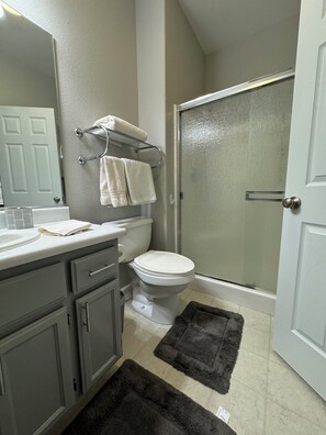 Shower, hair dryer, towels, soap