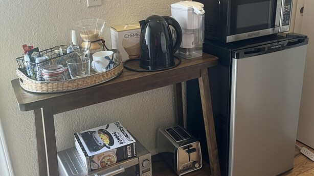 A kitchenette with a microwave, toaster, coffee maker, and a small refrigerator. - Charming studio in enchanting Napa walking distance to downtown (Napa)