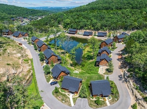 A residential area with houses arranged in a semi-circular pattern around a central water feature.