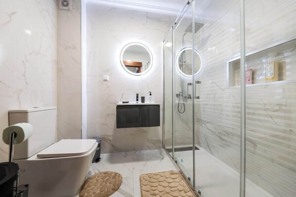 Shower, hair dryer, towels, soap