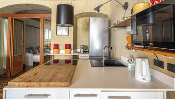 Fridge, microwave, stovetop, coffee/tea maker