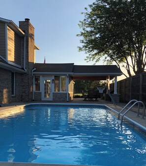 Outdoor pool, a heated pool - 4BR Home w/ Heated Pool, Arcade & More – less than 10 Min from Airport (Plainfield)