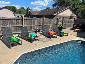 Outdoor pool, a heated pool - 4BR Home w/ Heated Pool, Arcade & More – less than 10 Min from Airport (Plainfield)