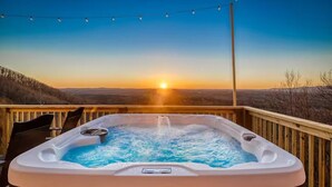 A hot tub on a wooden deck with a sunset view. - Best Views, Golf/Theater/GameRoom/HotTub7min to Town (Ellijay)