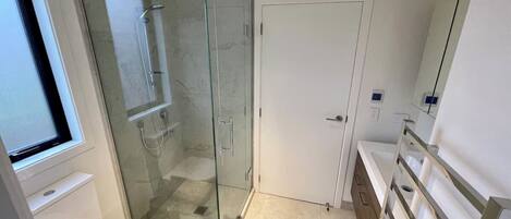 Shower, towels, soap, toilet paper