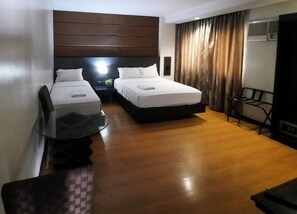 Executive Quadruple Room, Non Smoking, City View | Premium bedding, pillow-top beds, desk, free WiFi - Lorenzzo Suites Hotel (Makati)