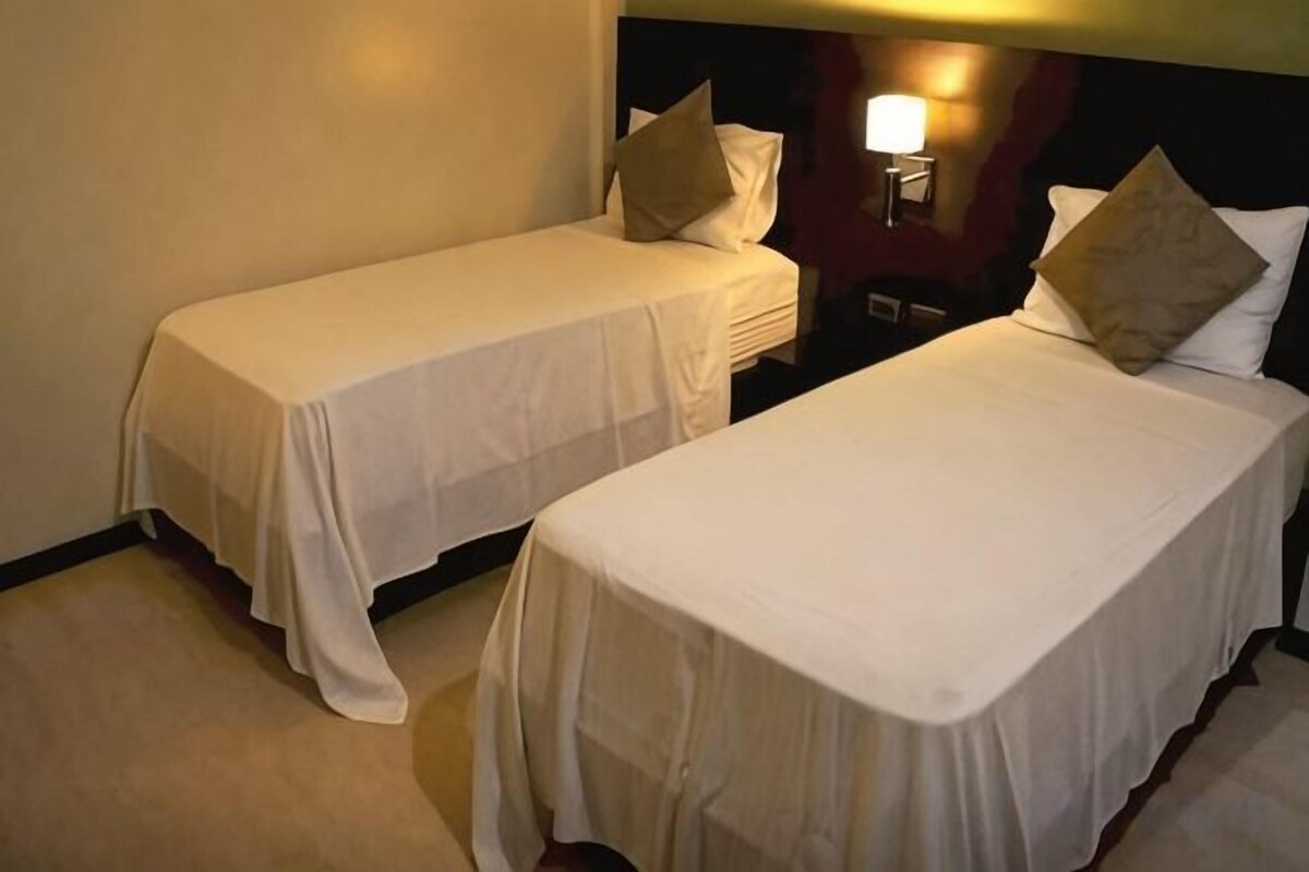 Premium bedding, pillow-top beds, desk, free WiFi