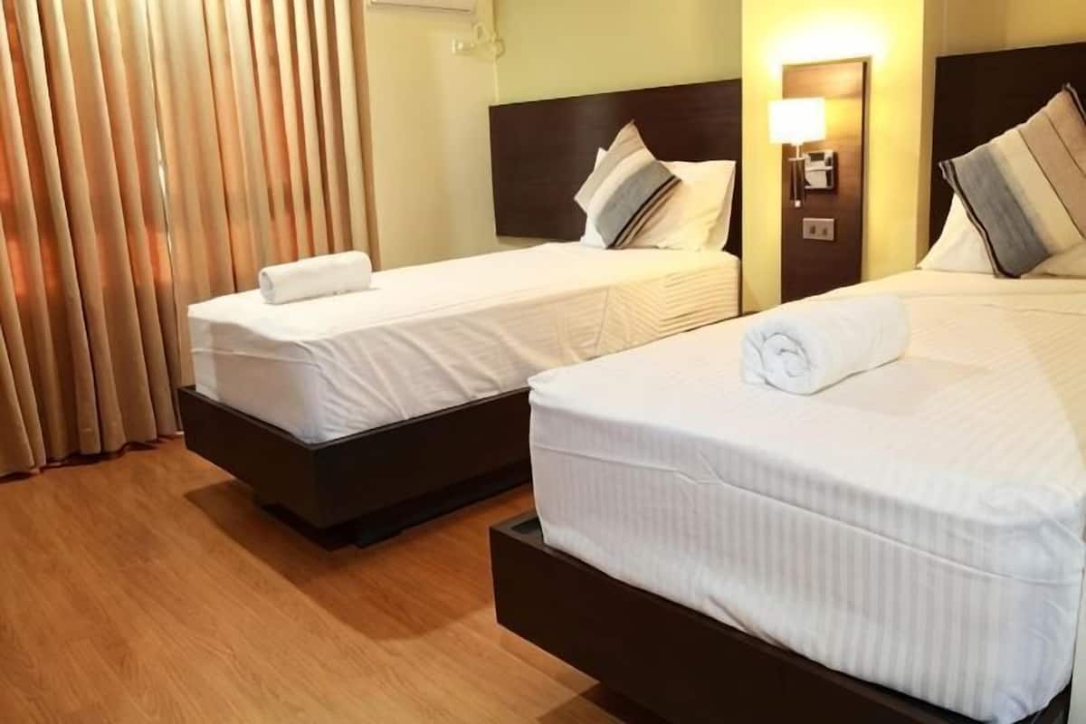 Premium bedding, pillow-top beds, desk, free WiFi