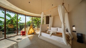 A spacious bedroom with a canopy bed, large windows, and a view of lush greenery. - Chongzuo Wild Stay Collection - Wanxiang (Chongzuo)