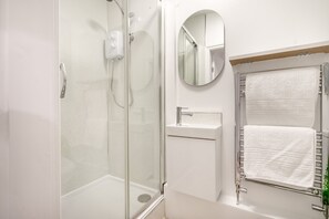 Shower, hair dryer, towels