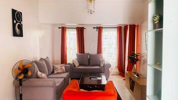 Family Villa, Garden View | Living area | 24-inch Smart TV with digital channels