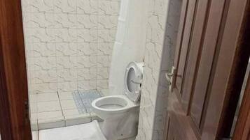 Shower, slippers, towels, soap