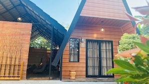 A modern building with a wooden facade, large windows, and a sign that reads "Sugae Nook." - Omah Abiza (Depok)