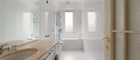 Hair dryer, bidet, towels, toilet paper