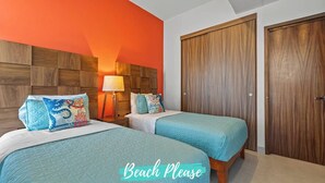 A bedroom with two beds, a wooden headboard, and a large wardrobe. - Vista Bucerias 402B - Rooftop Pool & Stunning Views (Bucerías)