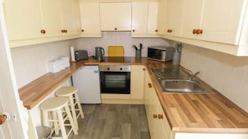 Fridge, electric kettle, toaster, cookware/dishes/utensils