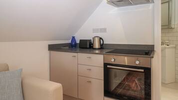 Fridge, electric kettle, toaster, cookware/dishes/utensils