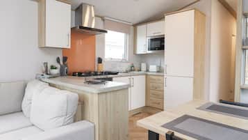 Fridge, electric kettle, cookware/dishes/utensils