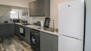 Fridge, electric kettle, cookware/dishes/utensils