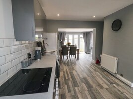 Fridge, electric kettle, cookware/dishes/utensils