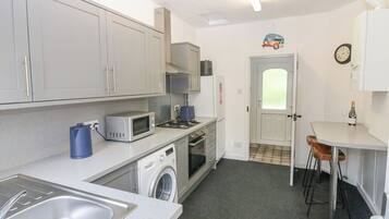 Fridge, electric kettle, toaster, cookware/dishes/utensils