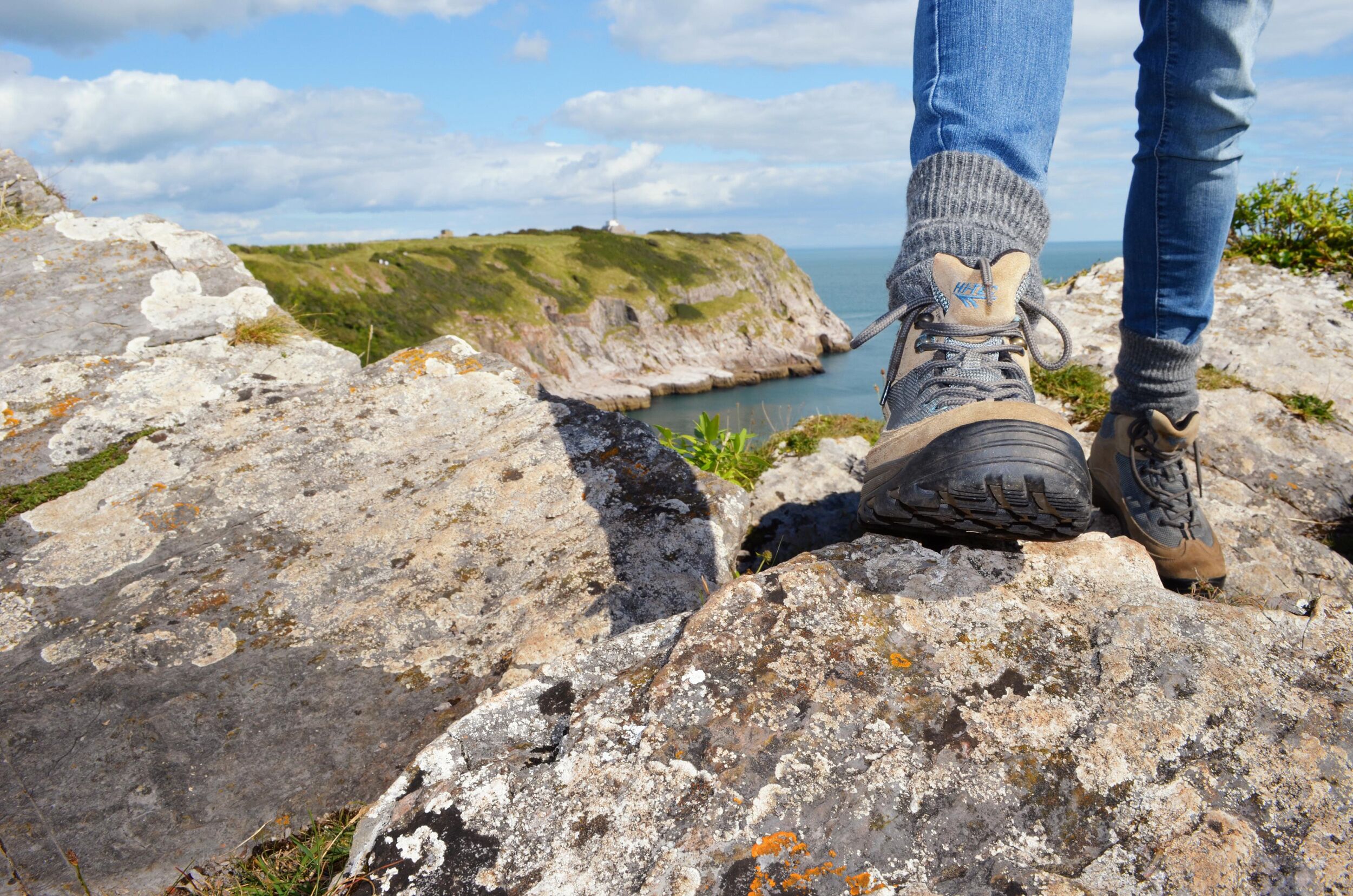 A rocky terrain with a coastal view.