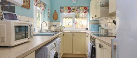 Fridge, dishwasher, electric kettle, cookware/dishes/utensils