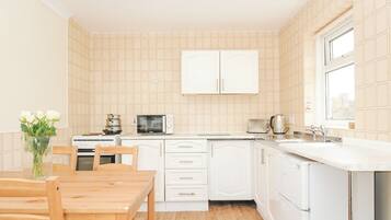 Fridge, electric kettle, toaster, cookware/dishes/utensils