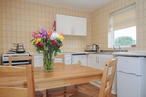 Fridge, electric kettle, toaster, cookware/dishes/utensils