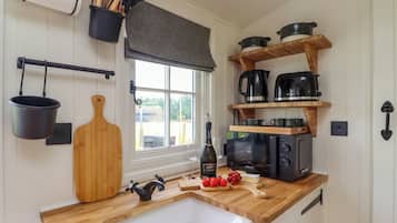 Fridge, electric kettle, toaster, cookware/dishes/utensils