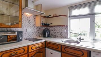 Fridge, electric kettle, toaster, cookware/dishes/utensils