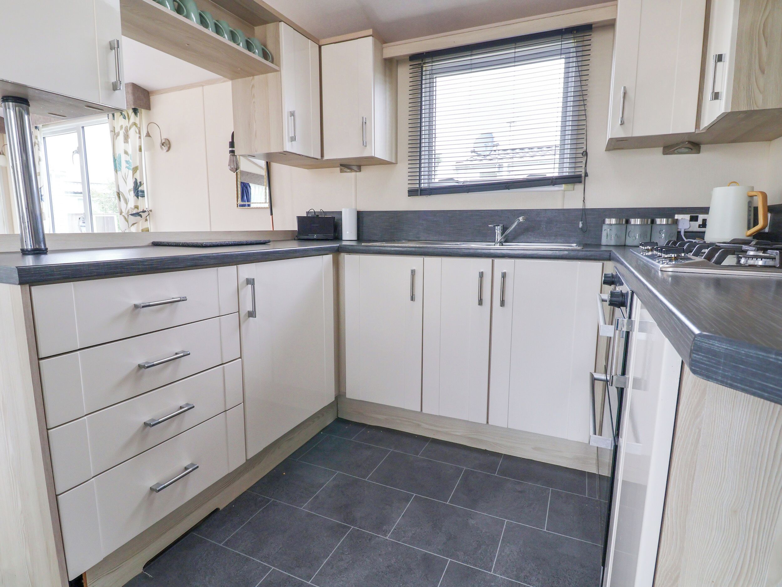 Fridge, electric kettle, cookware/dishes/utensils