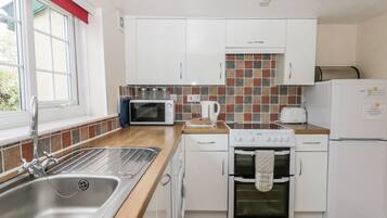 Fridge, electric kettle, toaster, cookware/dishes/utensils