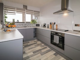 Fridge, electric kettle, cookware/dishes/utensils