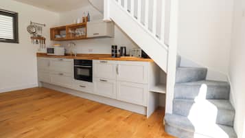 Fridge, electric kettle, toaster, cookware/dishes/utensils