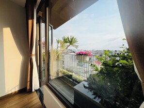 Deluxe Double Room Single Use, Balcony, City View | Blackout drapes, soundproofing, iron/ironing board, free WiFi - Cozy Garden Boutique hotel (Da Lat)