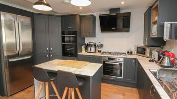 Fridge, electric kettle, toaster, cookware/dishes/utensils