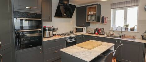 Fridge, electric kettle, toaster, cookware/dishes/utensils
