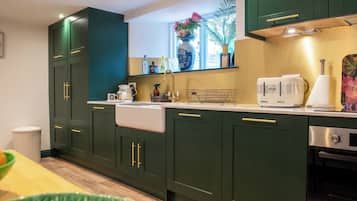 Fridge, electric kettle, toaster, cookware/dishes/utensils