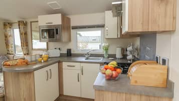 Fridge, electric kettle, toaster, cookware/dishes/utensils
